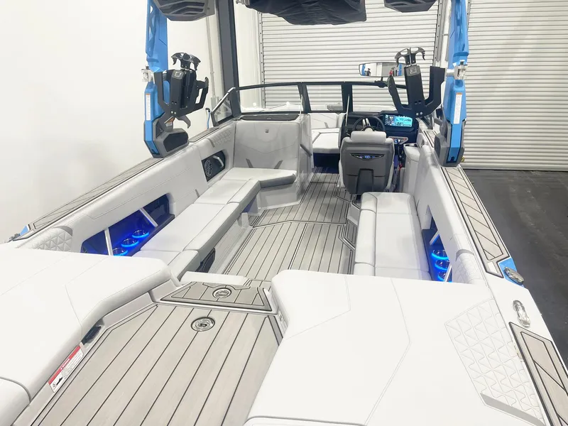 Slide: The Image of 2025 Nautique Super Air Nautique GS24 interior with sleek seating and modern dashboard. - 8