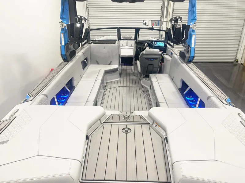 Slide: The Image of 2025 Nautique Super Air Nautique GS24 interior with sleek seating and modern dashboard. - 9