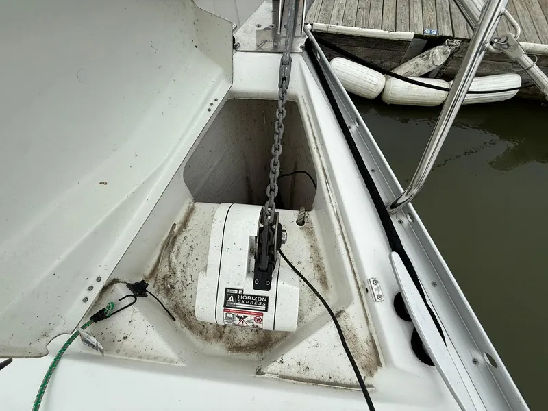 Slide: The Image of Anchor chain and winch on a 2003 Beneteau 393 sailboat at dock. - 10