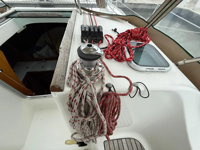 Slide: The Image of Deck of 2003 Beneteau 393 sailboat with ropes and winch. - 13