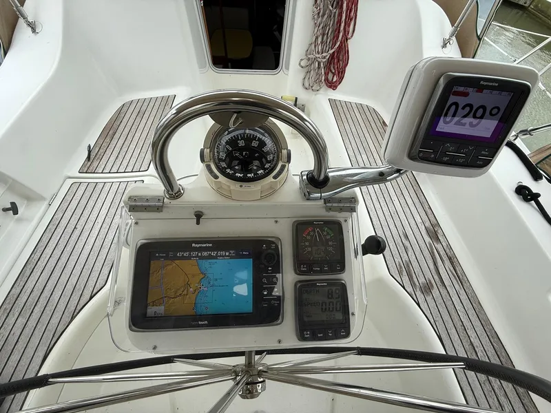 Slide: The Image of Cockpit of 2003 Beneteau 393 sailboat with navigation instruments and compass. - 18