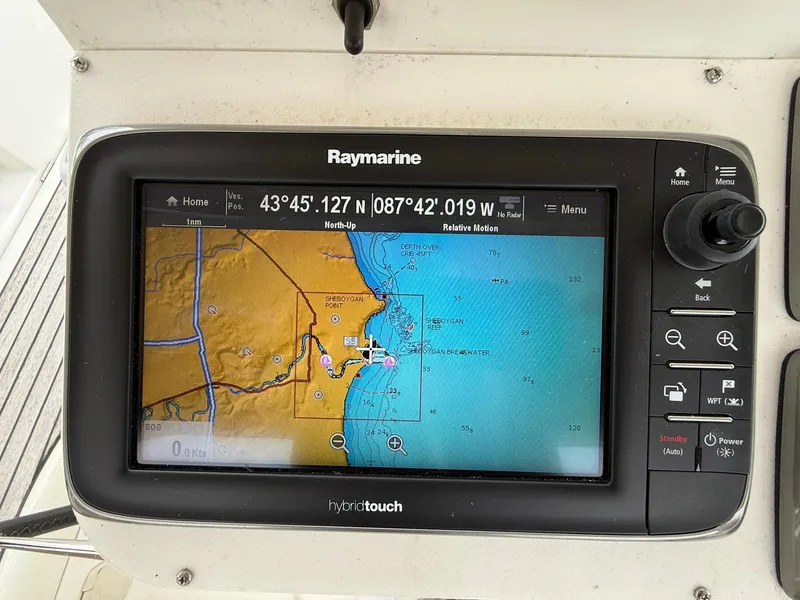 Slide: The Image of Raymarine navigation display on 2003 Beneteau 393, showing nautical chart and coordinates. - 19