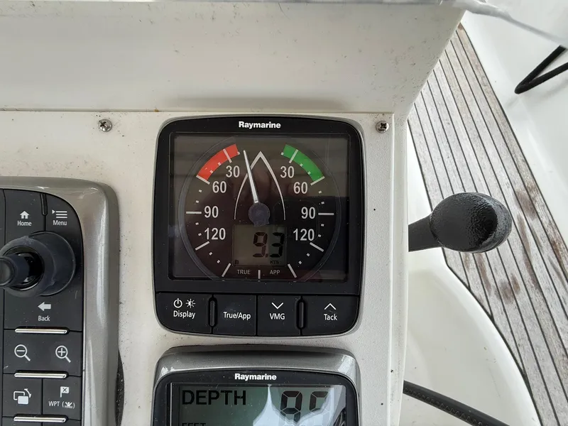 Slide: The Image of Raymarine instrument panel on a 2003 Beneteau 393 sailboat, displaying speed and depth. - 20