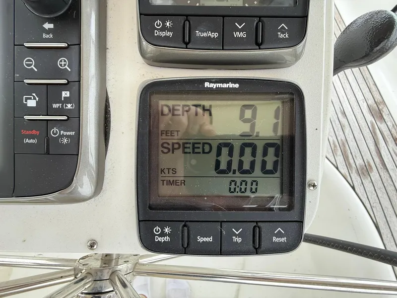 Slide: The Image of Raymarine display on 2003 Beneteau 393 showing depth and speed readings. - 22