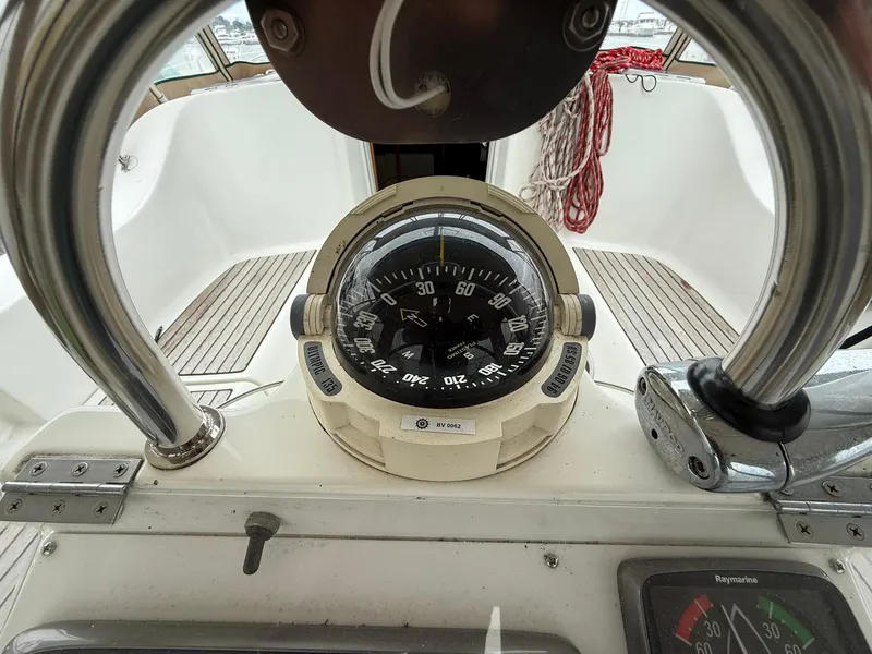 Slide: The Image of Compass and navigation instruments on a 2003 Beneteau 393 sailboat. - 23