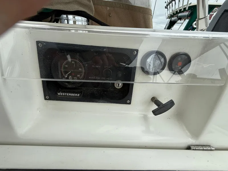 Slide: The Image of Control panel of a 2003 Beneteau 393 sailboat with Westerbeke engine gauges. - 24