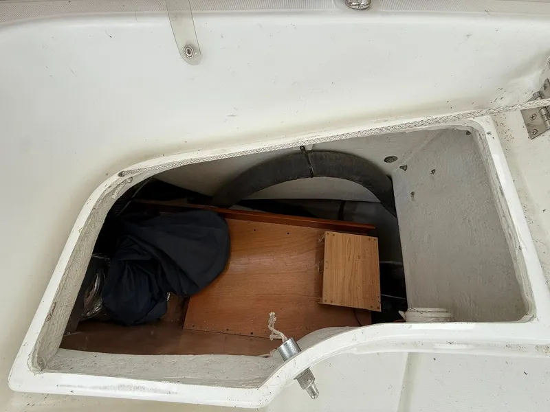 Slide: The Image of Storage compartment of a 2003 Beneteau 393 sailboat, showing interior details and equipment. - 27