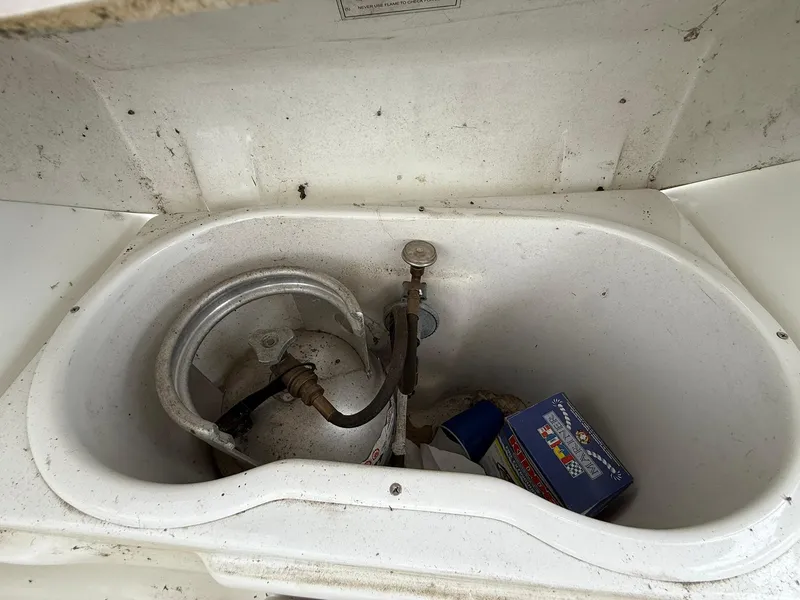 Slide: The Image of Storage compartment on a 2003 Beneteau 393 sailboat with propane tank and supplies. - 29