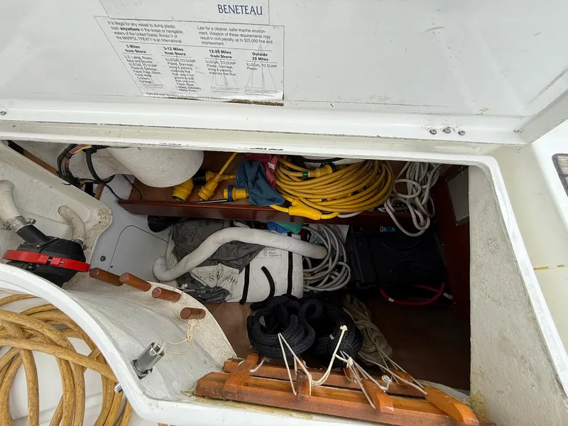 Slide: The Image of Storage compartment of a 2003 Beneteau 393 sailboat with ropes and equipment. - 30