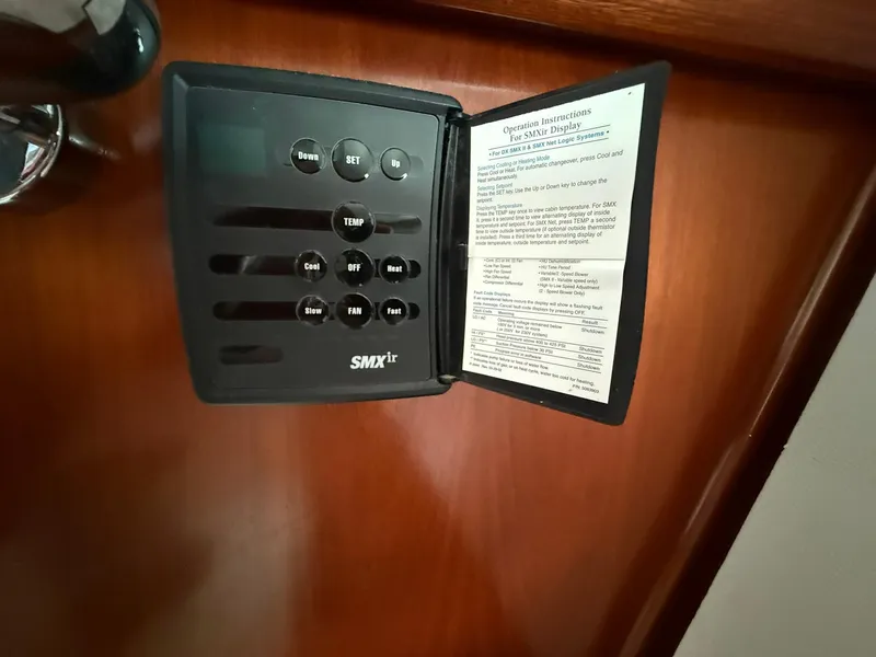 Slide: The Image of SMXir control panel on 2003 Beneteau 393 yacht, featuring temperature and fan settings. - 41