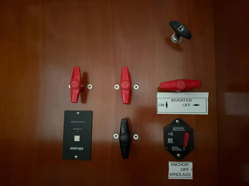 Slide: The Image of Control panel of a 2003 Beneteau 393 sailboat with switches and labels. - 46