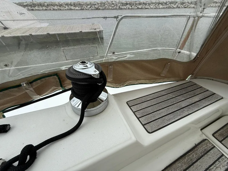 Slide: The Image of Deck view of a 2003 Beneteau 393 sailboat with winch and rope. - 7