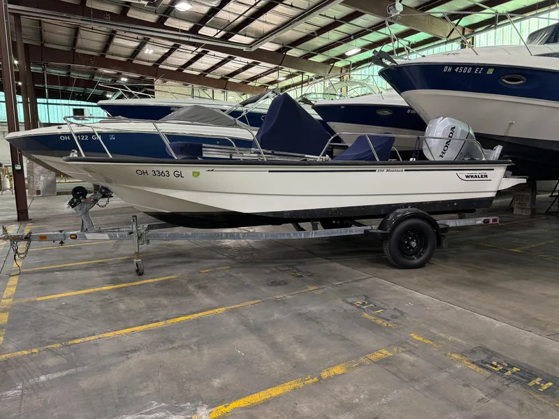 Slide: The Image of 2008 Boston Whaler 170 Montauk boat on trailer in indoor storage facility. - 17