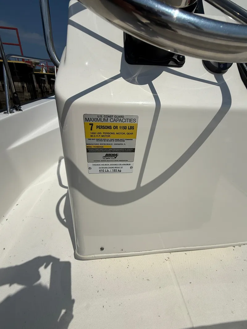 Slide: The Image of 2008 Boston Whaler 170 Montauk capacity label, showing maximum of 7 persons or 1150 lbs. - 6