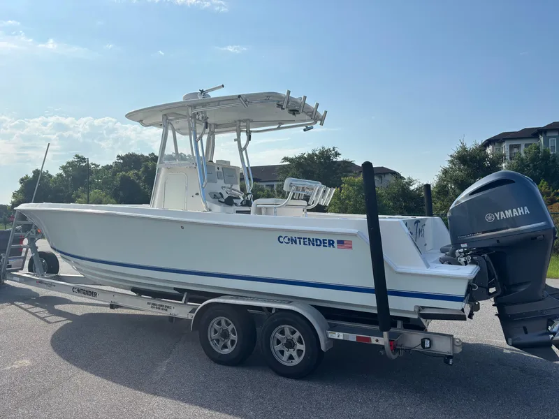 Slide: The Image of 2012 Contender 28 Sport boat on trailer with Yamaha outboard motor. - 6