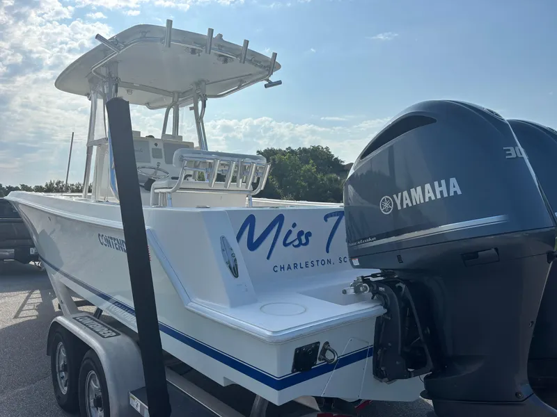 Slide: The Image of 2012 Contender 28 Sport boat with Yamaha engines, parked on a trailer. - 7