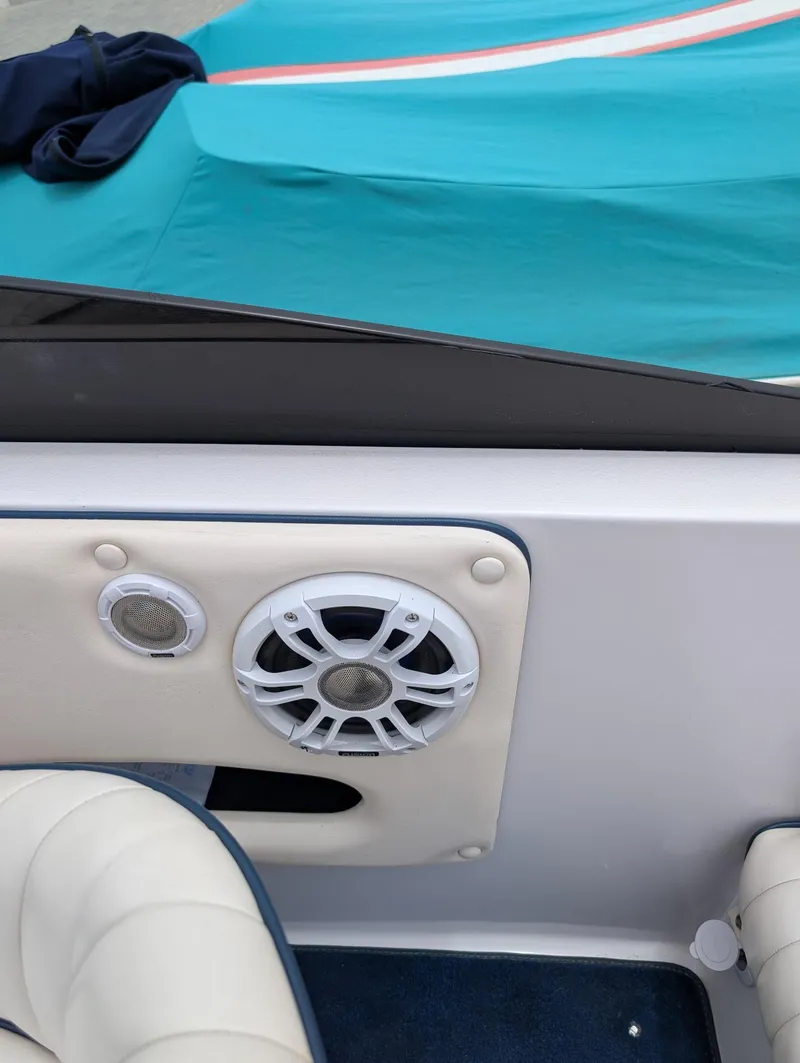 Slide: The Image of Interior of a 2005 Donzi boat featuring speakers and seating. - 13