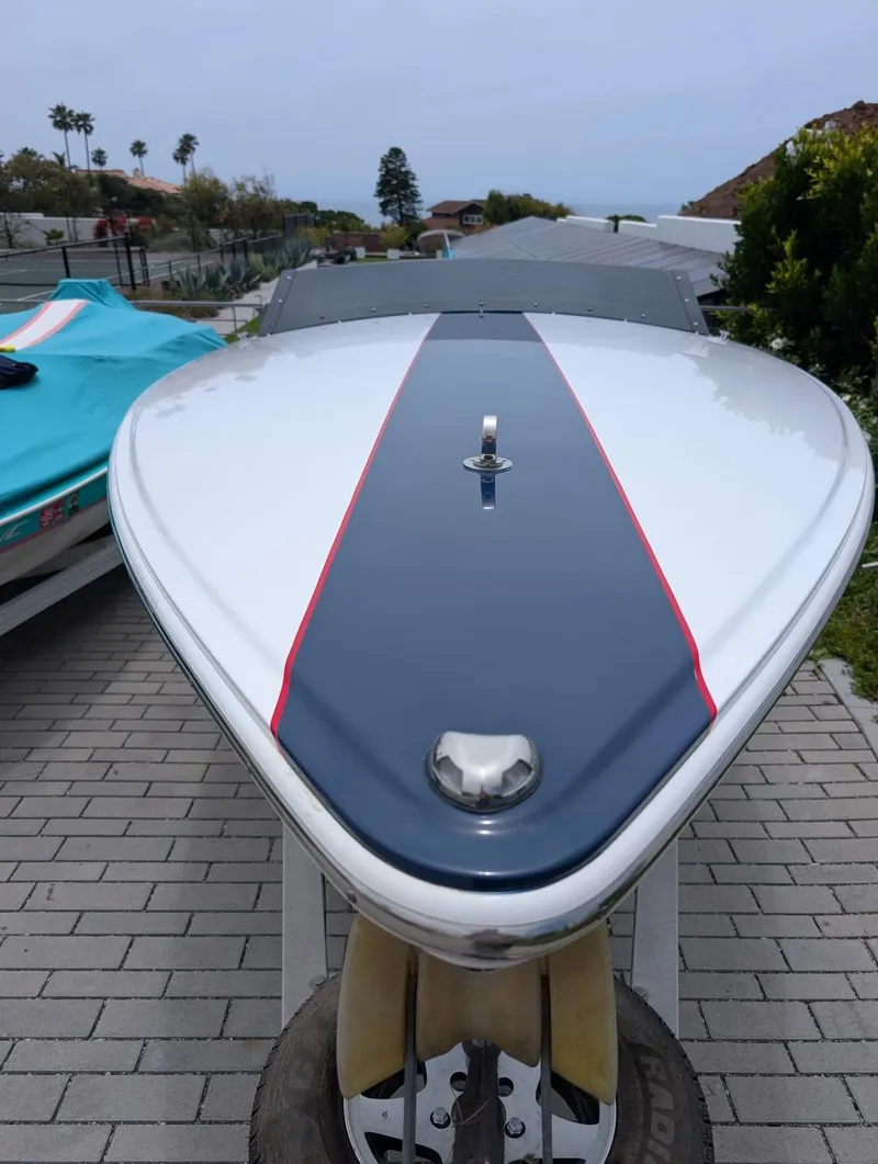 Slide: The Image of 2005 Donzi boat on trailer, sleek design with blue and red accents. - 15