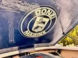 Slide: The Image of 2005 Donzi Marine logo on a boat's blue surface. - 20