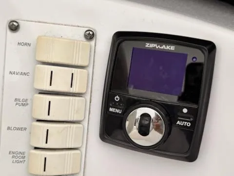 Slide: The Image of Control panel of a 2005 Donzi boat with Zipwake system and switches. - 8