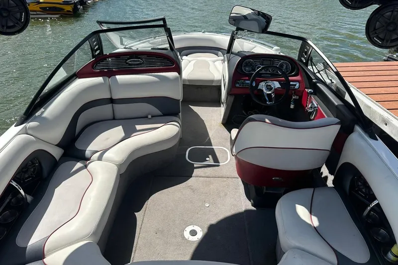 Slide: The Image of 2008 Malibu Wakesetter VTX boat interior with plush seating and modern dashboard. - 17