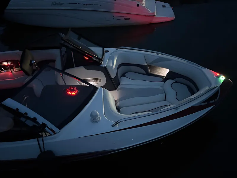 Slide: The Image of 2008 Malibu Wakesetter VTX boat interior with illuminated speakers at night. - 3