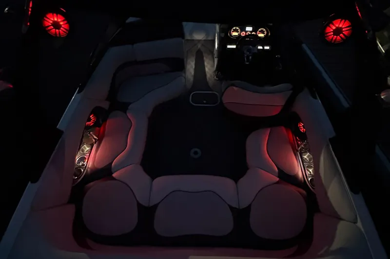 Slide: The Image of 2008 Malibu Wakesetter VTX boat with illuminated interior and speakers at night. - 5