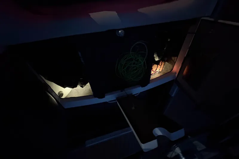 Slide: The Image of Dashboard of a 2008 Malibu Wakesetter VTX boat with illuminated gauges at night. - 10