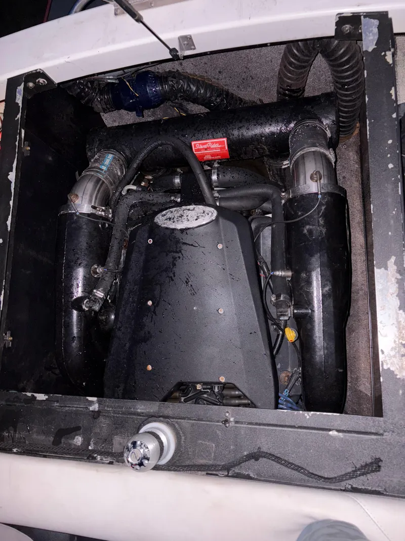 Slide: The Image of 2008 Malibu Wakesetter VTX interior storage compartment with lighting and equipment. - 11