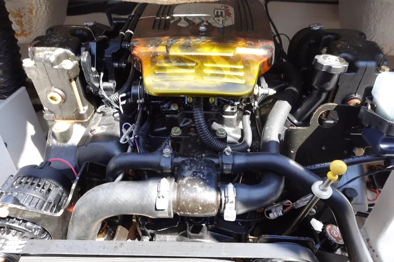 Slide: The Image of Engine of a 2004 Chaparral 210 SSi boat, showcasing mechanical components and hoses. - 4