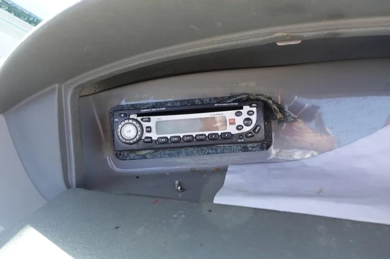 Slide: The Image of 2004 Chaparral 210 SSi boat dashboard with a CD player installed. - 6