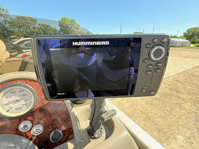 Slide: The Image of Humminbird Helix 7 fish finder on 2005 Bass Tracker PGV16 boat dashboard. - 15