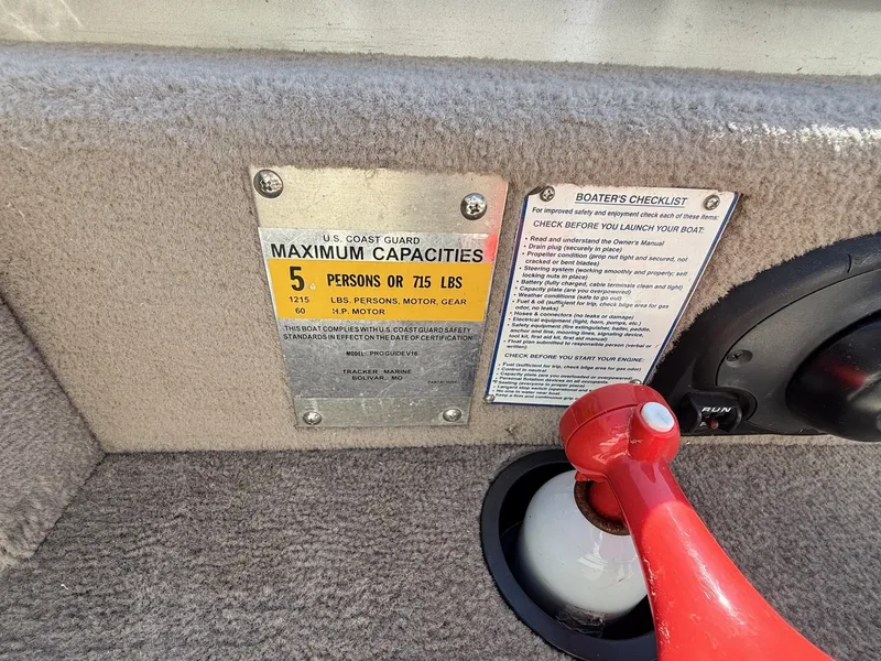 Slide: The Image of 2005 Bass Tracker PGV16 boat capacity and safety checklist with red safety switch. - 17