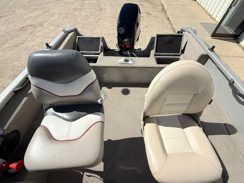 Slide: The Image of 2005 Bass Tracker PGV16 boat interior with two seats and motor. - 18