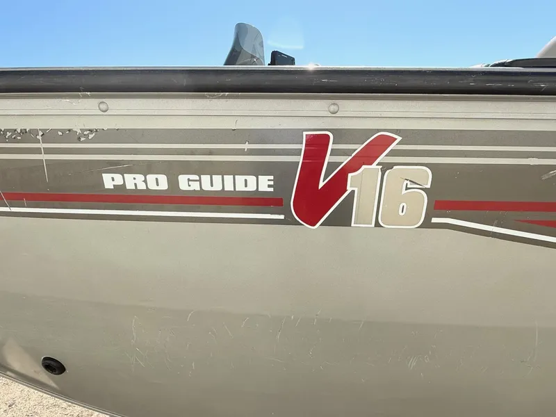 Slide: The Image of 2005 Bass Tracker PGV16 boat with "Pro Guide V16" decal on the side. - 5