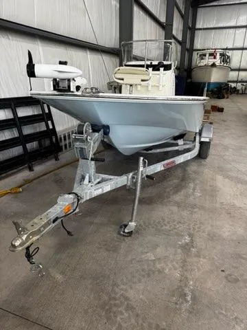 Slide: The Image of 2021 Boston Whaler 150 Montauk boat on trailer in storage facility. - 20