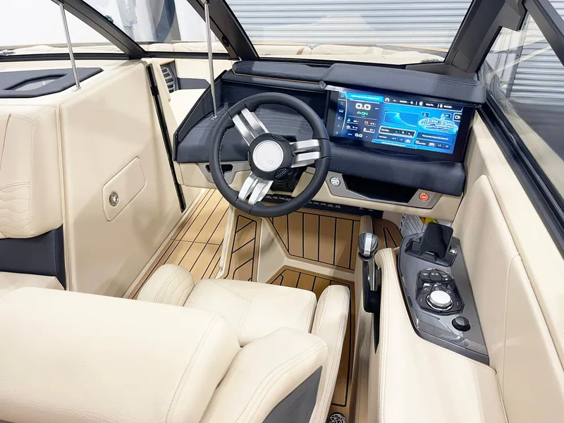 Slide: The Image of 2025 Nautique Super Air Nautique G25 interior with modern dashboard and touchscreen display. - 6