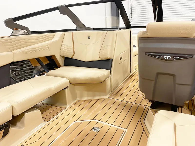 Slide: The Image of 2025 Nautique Super Air Nautique G25 interior with beige seating and sleek design. - 7