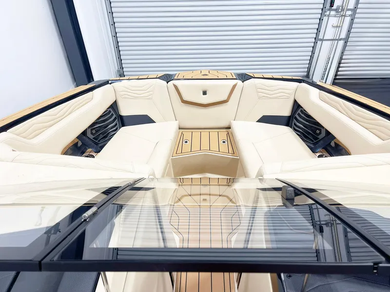 Slide: The Image of 2025 Nautique Super Air Nautique G25 interior with luxurious seating and sleek design. - 8