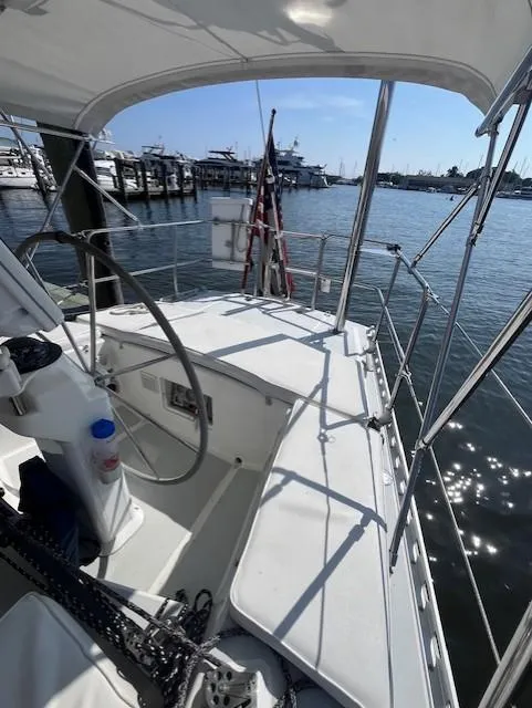 Slide: The Image of Sailboat cockpit view, 1998 J Boats J/42, docked at marina under clear sky. - 19