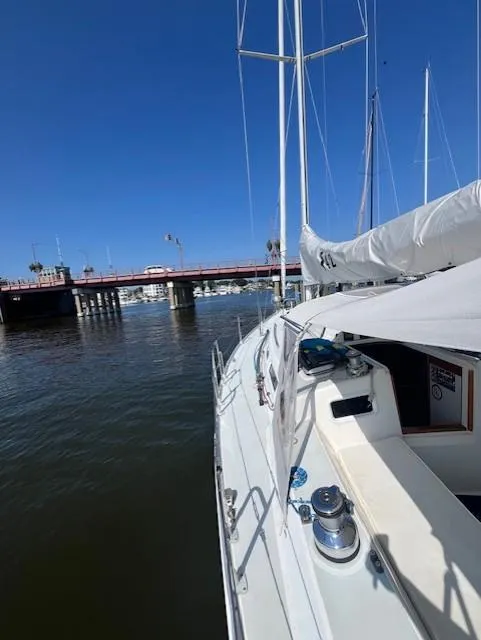 Slide: The Image of Sailing yacht J Boats J/42 (1998) near a bridge on a sunny day. - 21