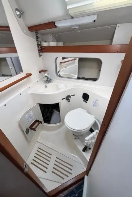Slide: The Image of 1998 J Boats J/42 yacht bathroom with sink, toilet, and mirror. - 33
