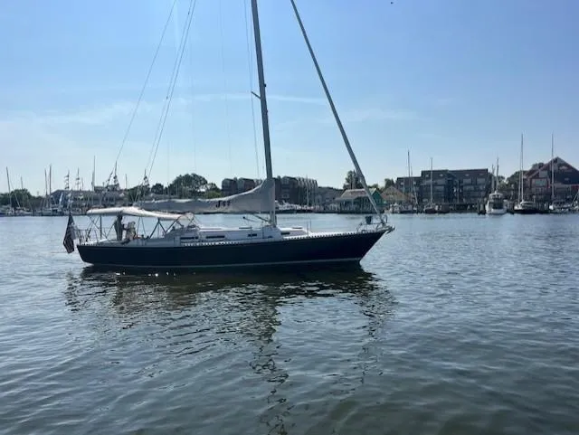 Slide: The Image of Sailboat J/42 from 1998 by J Boats on calm water, sunny day. - 4