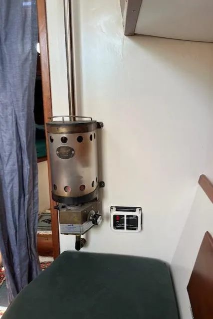 Slide: The Image of 1979 Morris Leigh 30 interior with vintage wall-mounted heater. - 7