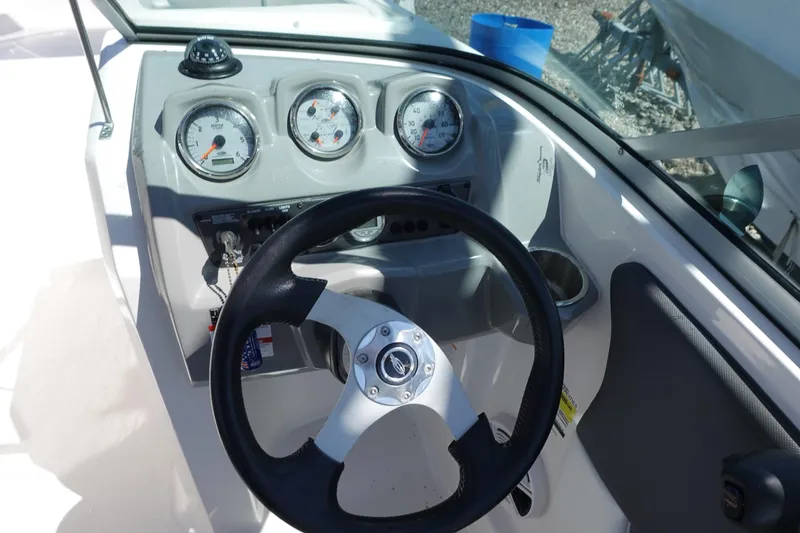 Slide: The Image of Steering wheel and dashboard of 2013 Chaparral 19 Sport H2O boat. - 4