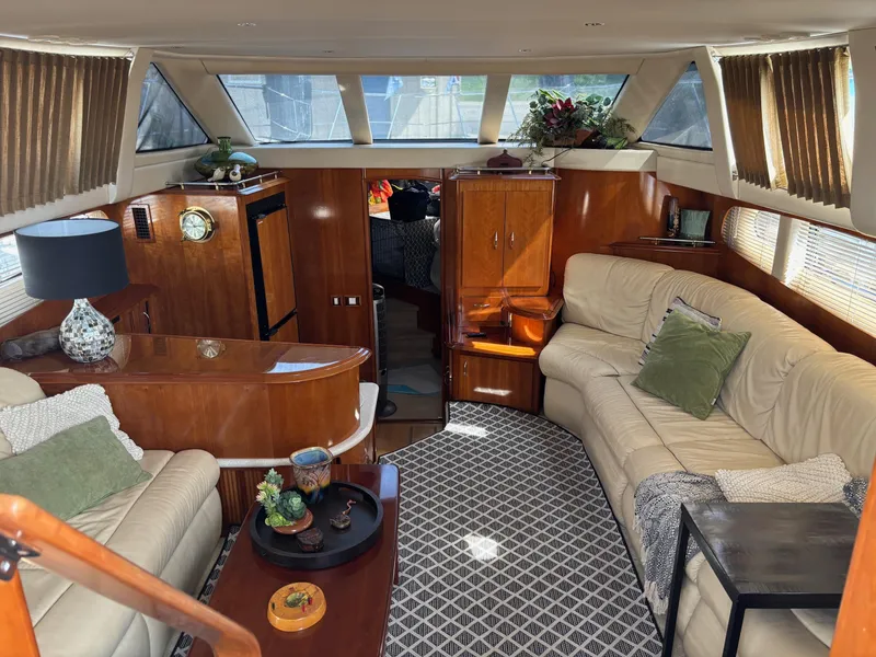 Slide: The Image of Luxurious interior of 2003 Carver 444 Cockpit Motor Yacht with elegant furnishings and decor. - 32