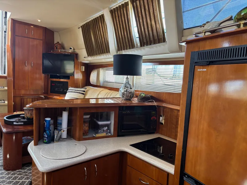 Slide: The Image of Luxurious interior of 2003 Carver 444 Cockpit Motor Yacht with modern amenities. - 33