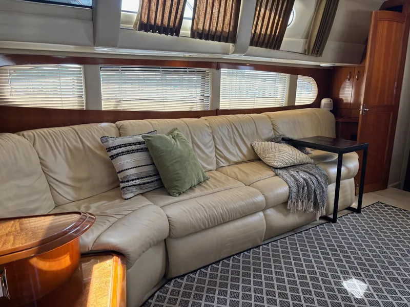 Slide: The Image of Luxurious interior of 2003 Carver 444 Cockpit Motor Yacht with leather sofa and elegant decor. - 34