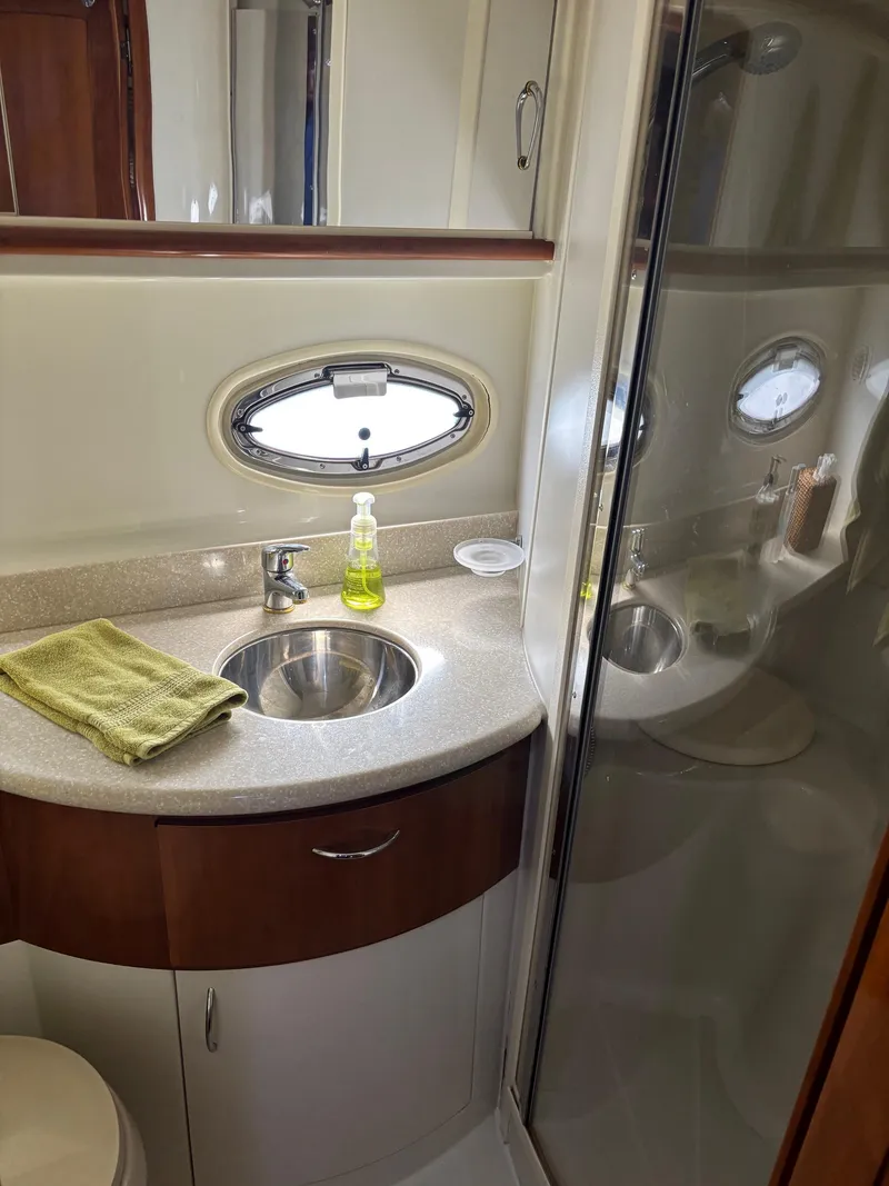 Slide: The Image of 2003 Carver 444 Cockpit Motor Yacht bathroom with sink, mirror, and shower. - 37