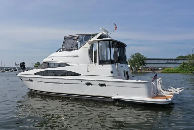 Slide: The Image of Engine compartment of a 2003 Carver 444 Cockpit Motor Yacht, showcasing detailed mechanical components. - 42